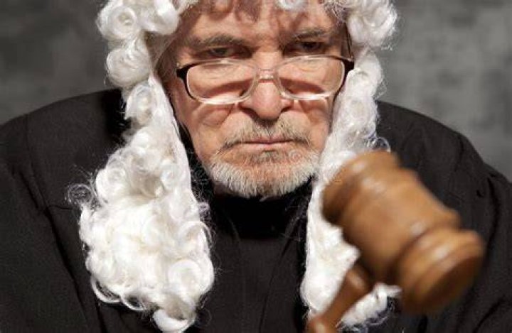 Old Male Judge in a Courtroom Striking the Gavel Stock Image Image of
